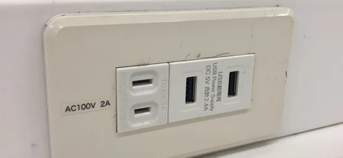 A two-slot 100V outlet and USB charging ports at a Lawson convenience store in Aichi