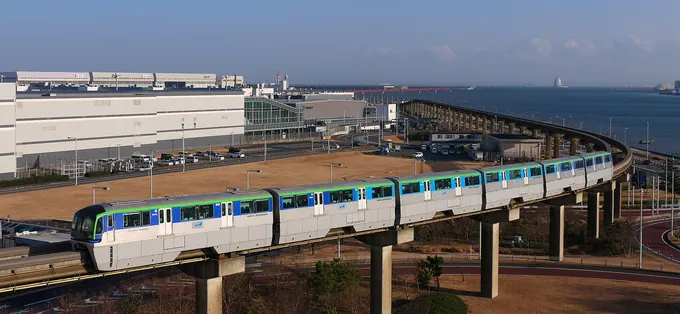 A Tokyo Monorail train on the elevated line beside Haneda Airport
