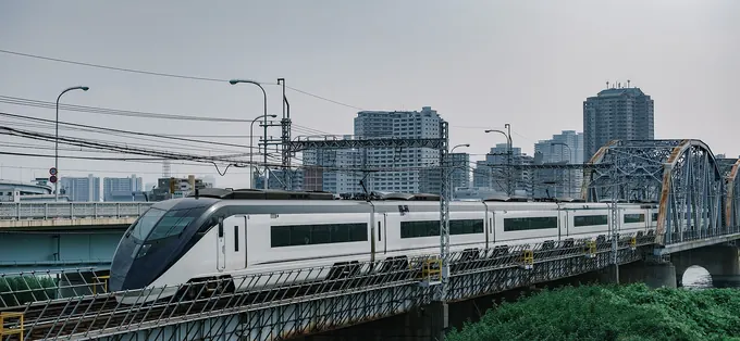 A Keisei Skyliner train crossing a bridge in Tokyo