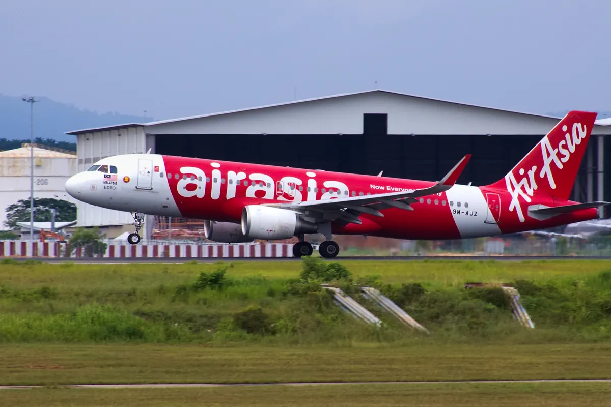 AirAsia Airbus A320 aircraft landing at Kuala Lumpur International Airport