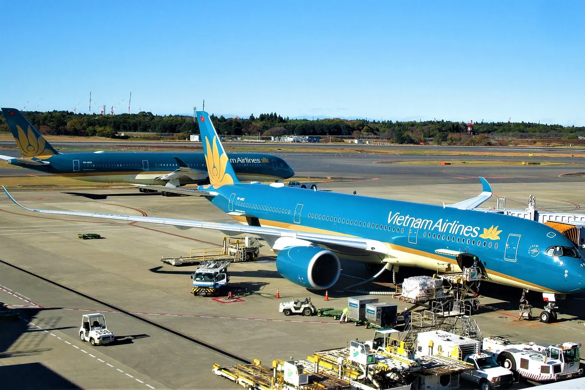 Two Vietnam Airlines Airbus A350 aircraft in blue livery parked at Narita Airport