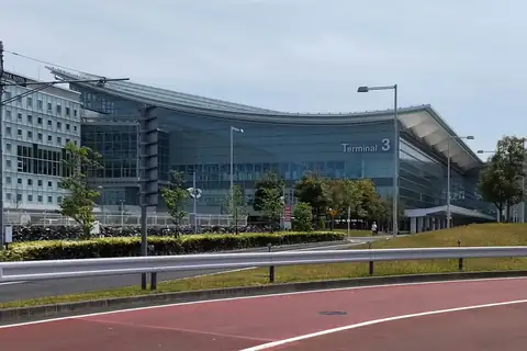 Exterior of the Haneda Airport Terminal 3 building with its glass facade and Terminal 3 signage