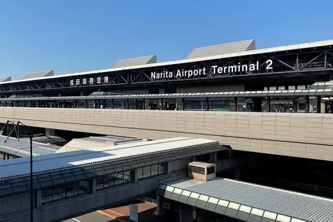 Exterior of Narita Airport Terminal 2 building with its name on signage above the entrance