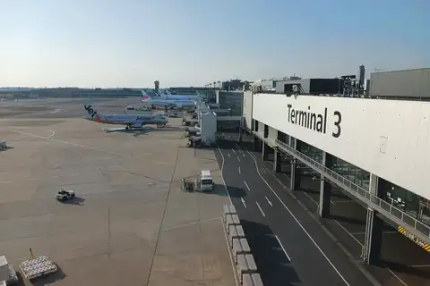Exterior of Terminal 3 at Narita International Airport with aircraft parked on the tarmac