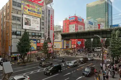 A street intersection in Akihabara Electric Town, Tokyo, lined with multi-storey stores and signboards