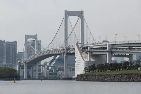 White Rainbow Bridge suspension bridge spanning the bay, seen from Odaiba in Tokyo