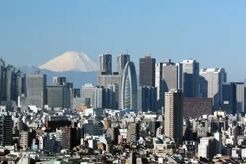 Skyline of Shinjuku skyscrapers in Tokyo with Mount Fuji visible in the distance