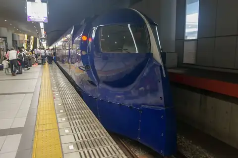 Dark blue Nankai Rapi:t limited express train at a platform in Kansai Airport Station