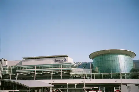 Haneda Airport Terminal 2 building with a round glass facade