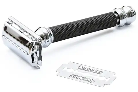 A chrome safety razor with a black knurled handle and a loose blade beside it on a white background