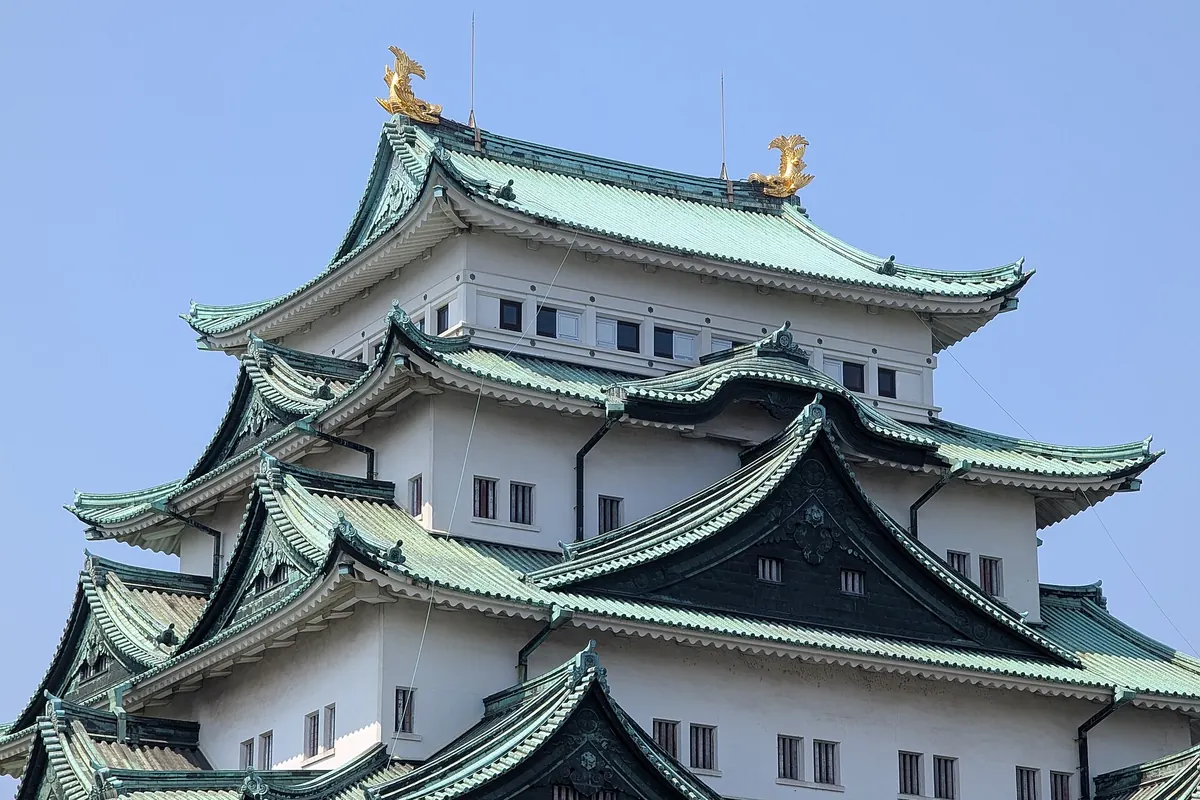 Nagoya Castle's keep with two golden shachihoko ornaments on its green roof