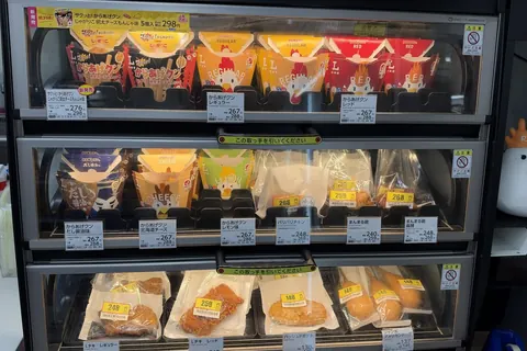 The hot snack case at a Lawson in Tokyo on 20 October 2026, with the Jagarico Karaage-kun on the top shelf at 298 yen with tax