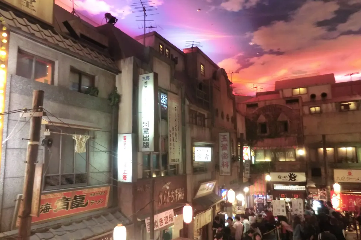 Recreated old street scene with lanterns, shopfronts and crowds inside the Shin-Yokohama Ramen Museum