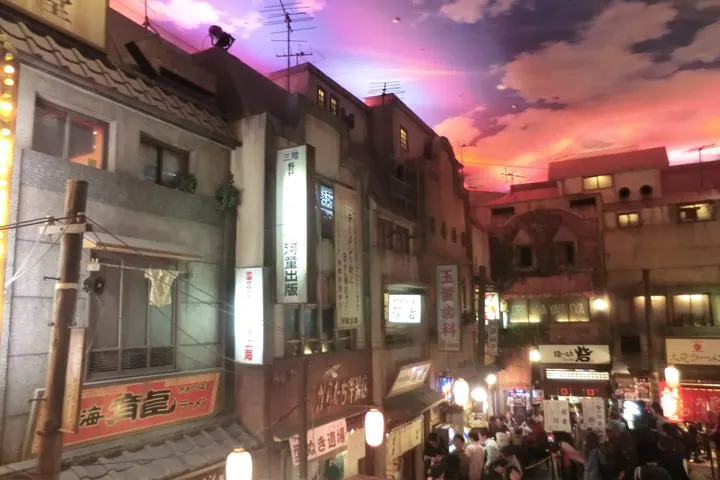 Recreated old street scene with lanterns, shopfronts and crowds inside the Shin-Yokohama Ramen Museum