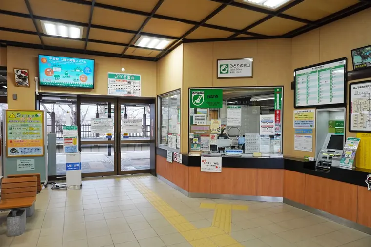 The ticket gate and ticket office inside JR Hiraizumi Station in Iwate.