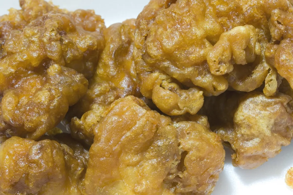 Close-up of golden-brown chicken karaage pieces with a glossy coating