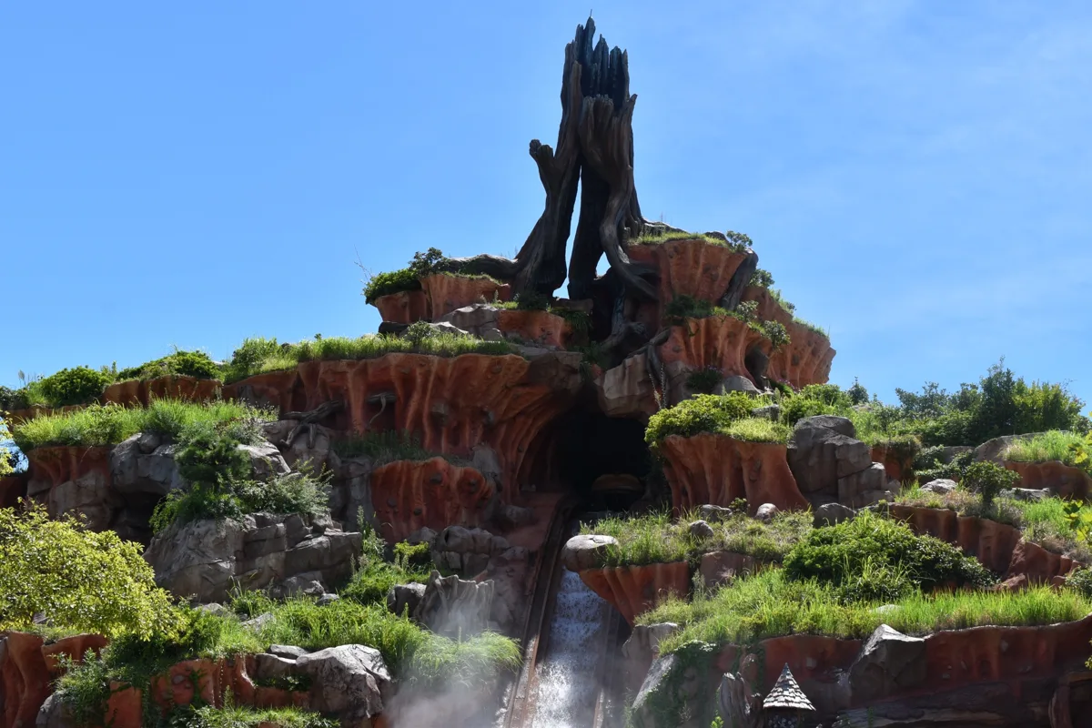 Splash Mountain's rocky peak and drop under a blue sky