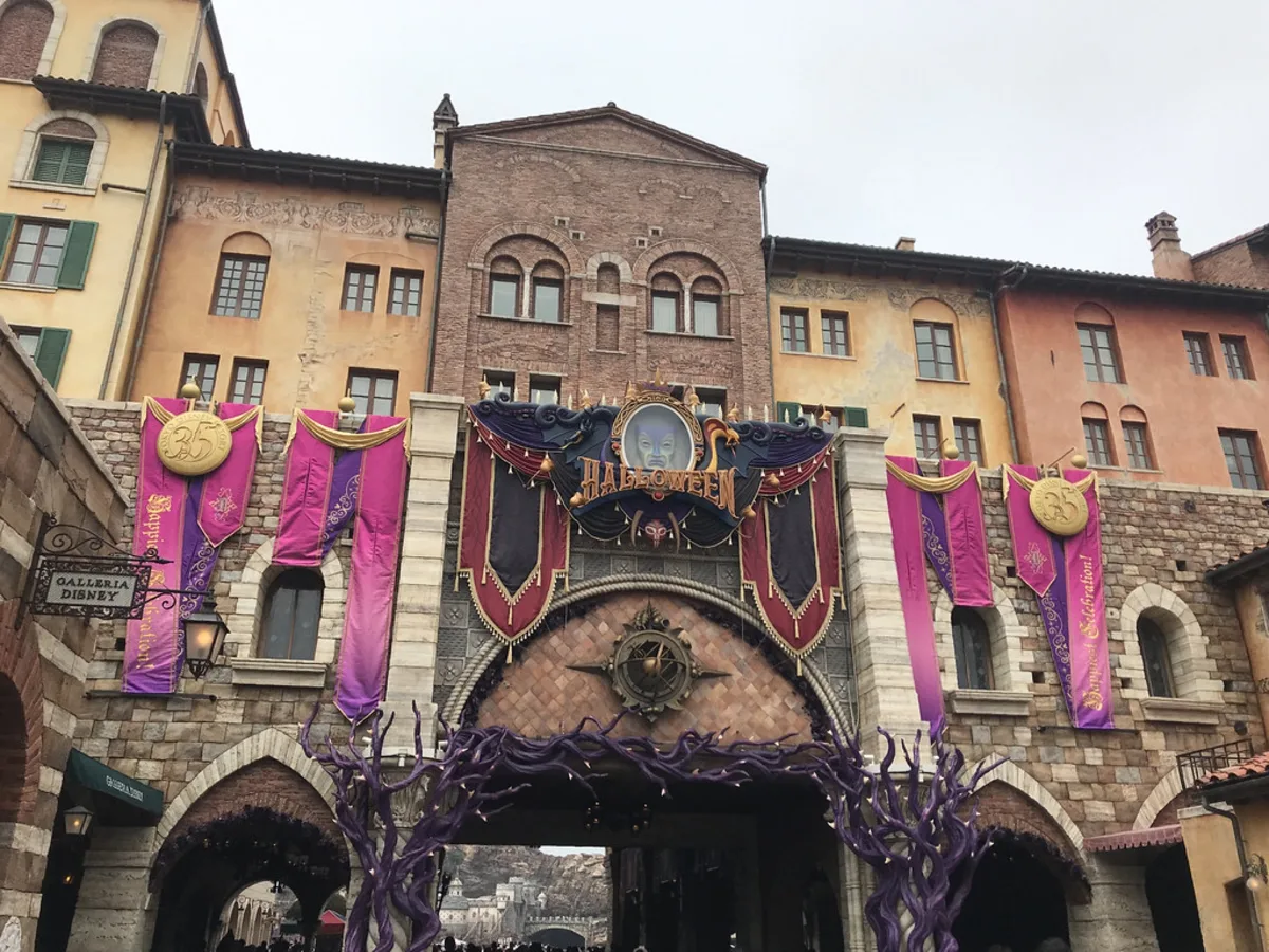 Tokyo DisneySea building facade hung with purple Halloween banners