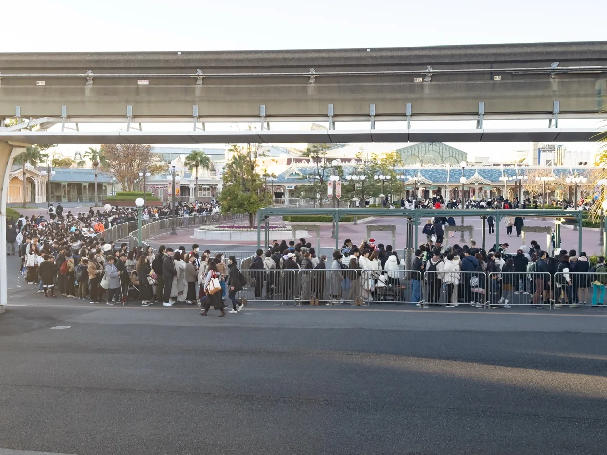 Long queue of visitors lined up outside the Tokyo Disneyland main entrance