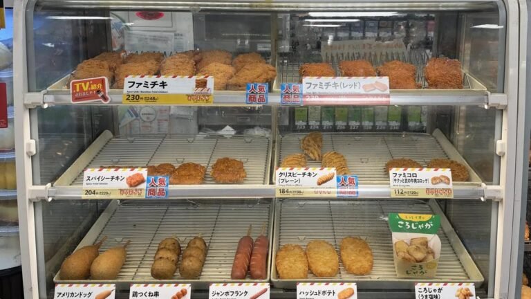 The hot snack case at a FamilyMart in Tokyo, with Famichiki on the top shelf