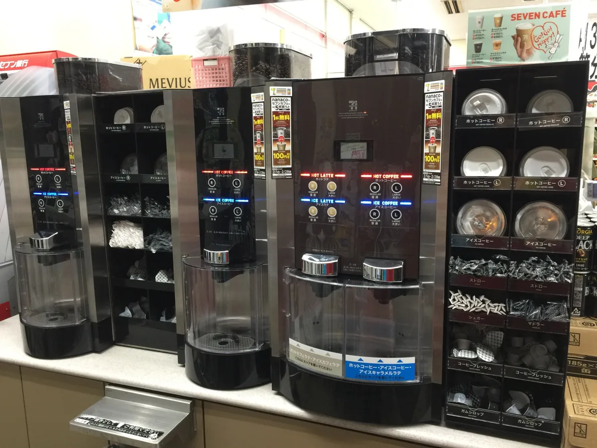Seven Cafe coffee machines with R and L buttons at a 7-Eleven in Shimonoseki, photographed in 2019