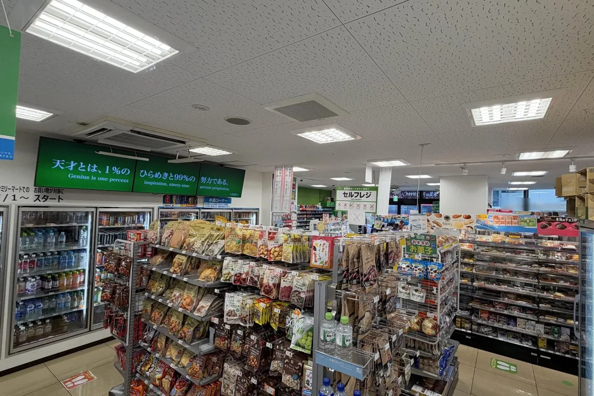 Inside a FamilyMart in Tokyo: snack shelves, drink fridges and a self-checkout sign
