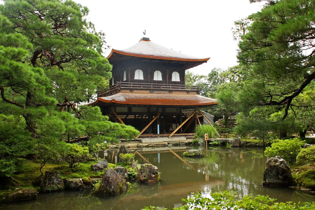 The wooden Silver Pavilion of Ginkaku-ji in Kyoto, reflected in a garden pond