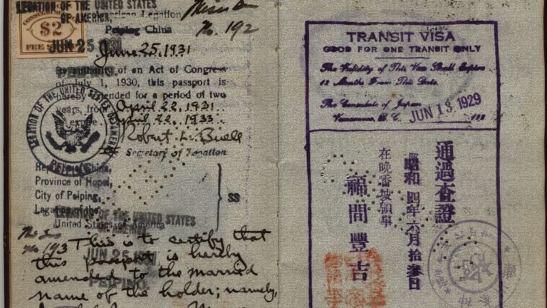 Open passport pages with a 1929 Japanese transit visa stamp from the Consulate of Japan and other stamps