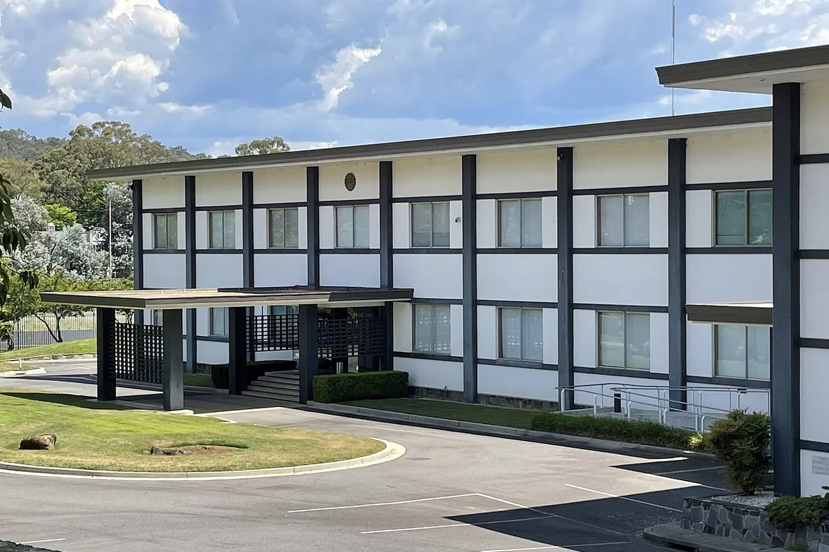 The two-story chancery building of the Embassy of Japan in Canberra, Australia with a covered entrance