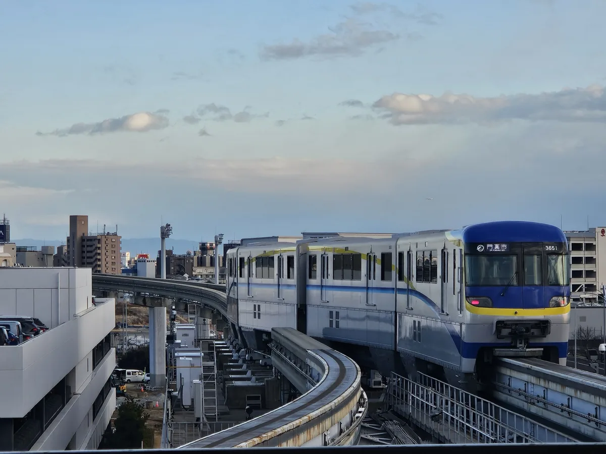 An Osaka Monorail 3000 series train on the elevated track, in 2025
