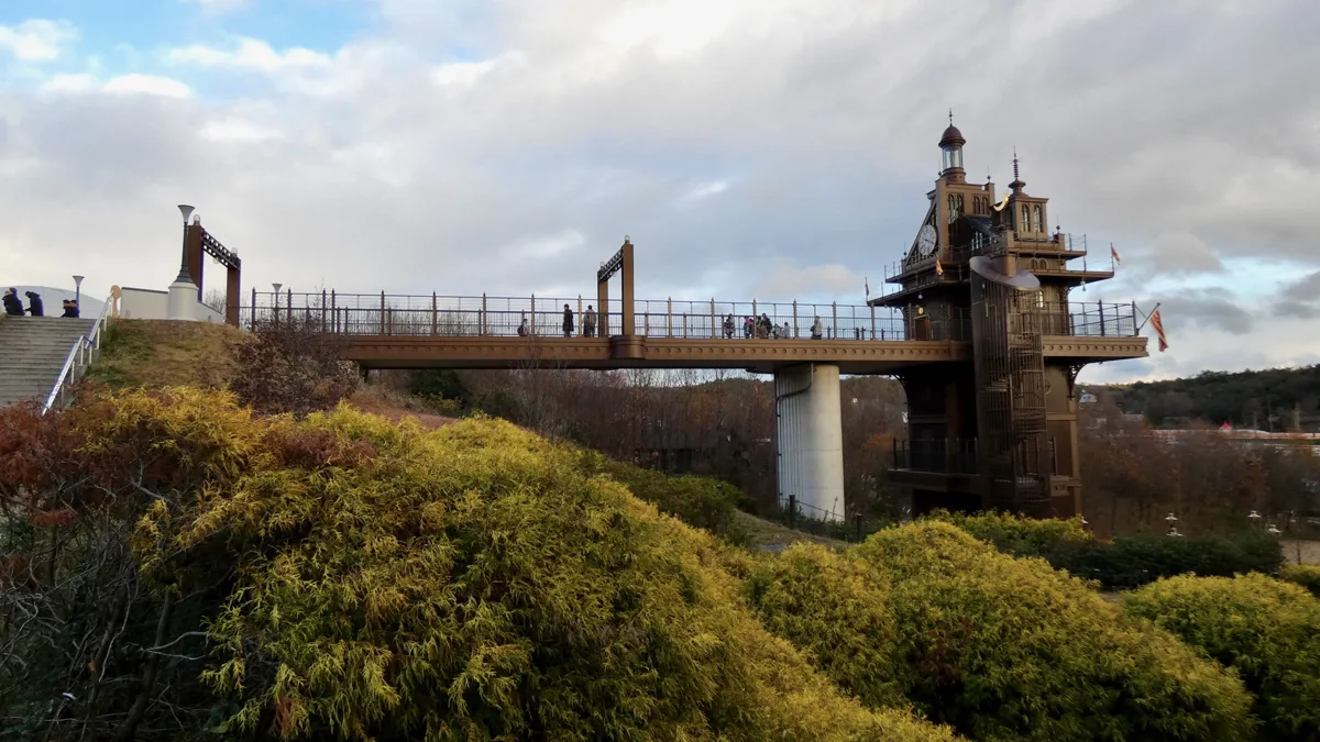 The elevator tower and walkway of the Hill of Youth area at Ghibli Park in Aichi, in 2023