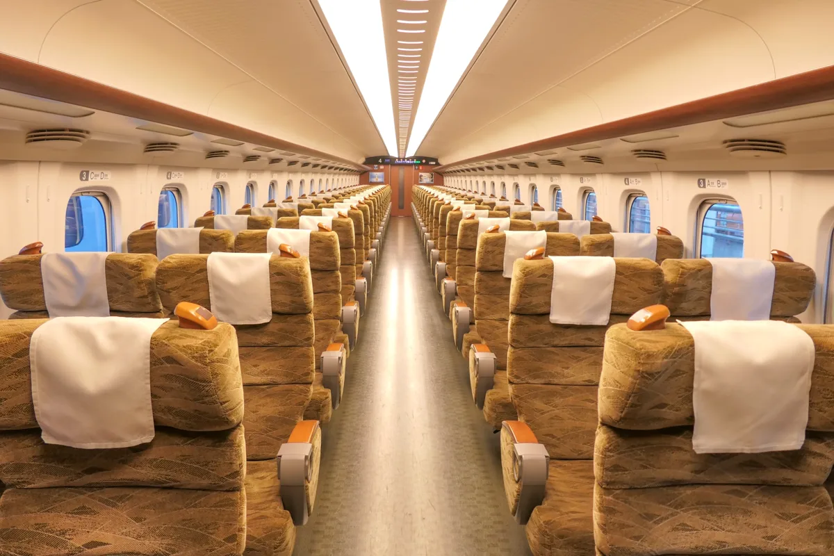 Reserved seats in two-by-two rows in an ordinary car of a JR West N700-7000 series Shinkansen train in 2022