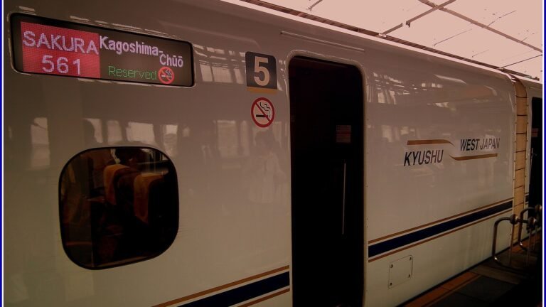 An N700 series Sakura train with a Kagoshima-Chuo destination sign on its side at a station platform