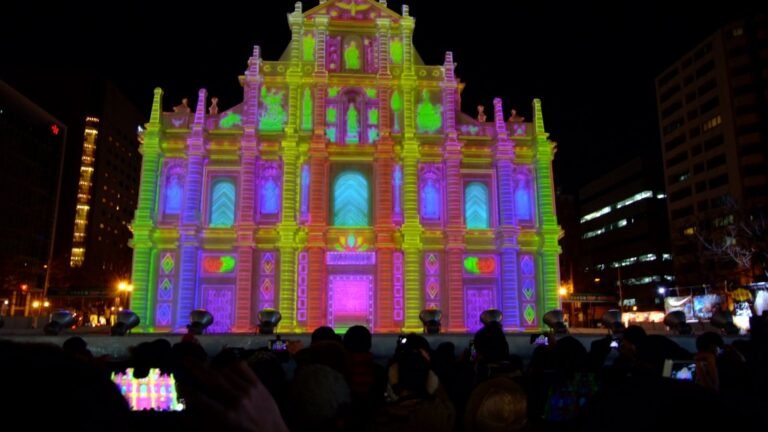 Projection mapping on a large snow sculpture at night at the Sapporo Snow Festival Odori site