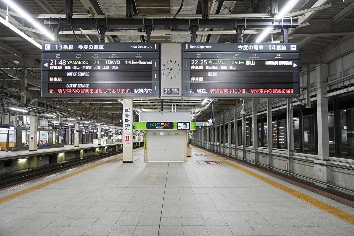 Departure boards for platforms 13 and 14 above an empty Shinkansen platform at JR Sendai Station