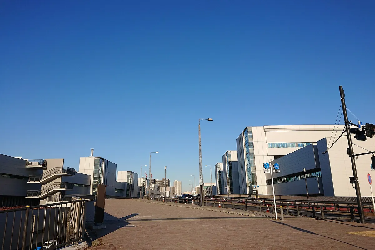 An empty paved square between buildings near the Toyosu Market area in Tokyo