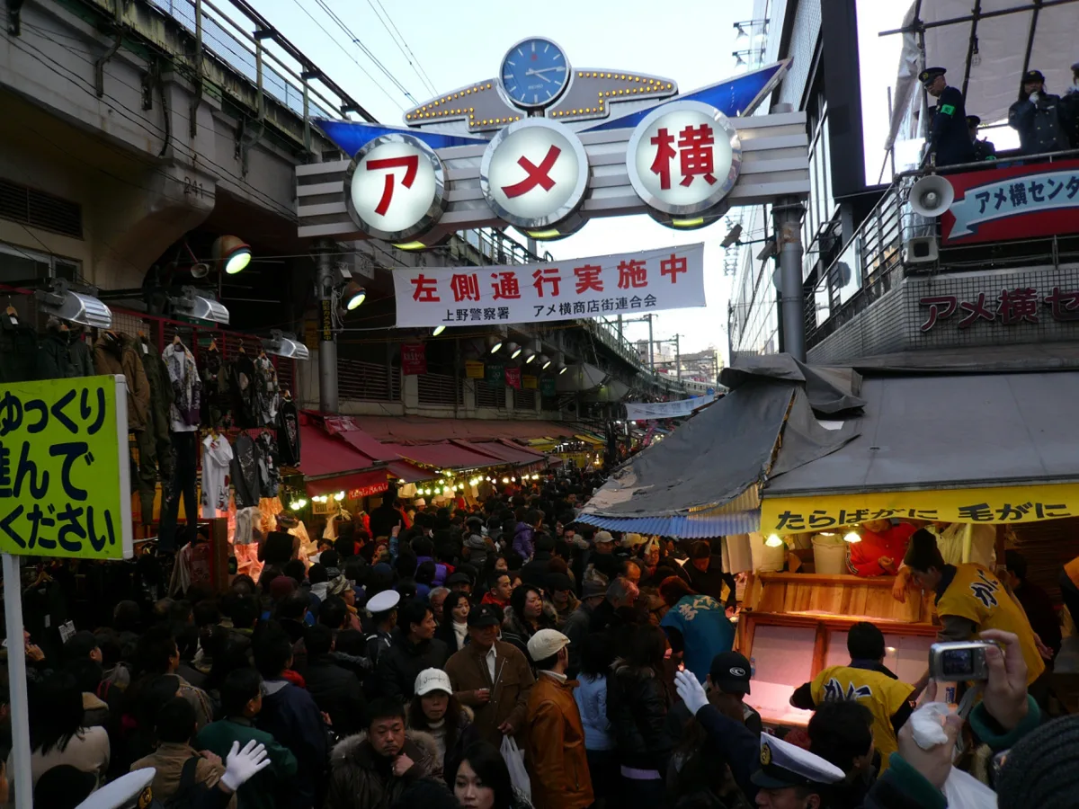 Shoppers in winter coats on Ameyoko street in Tokyo on New Year's Eve