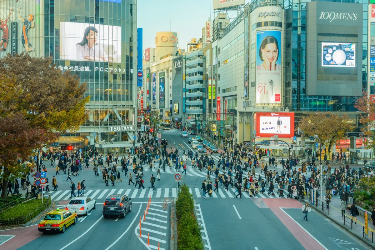 People in coats crossing the Shibuya Scramble Crossing in Tokyo on 2 December 2016